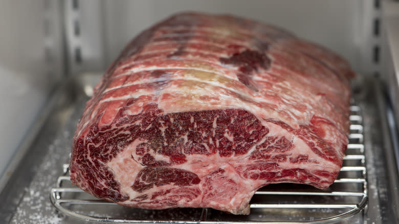 Raw prime rib on rack