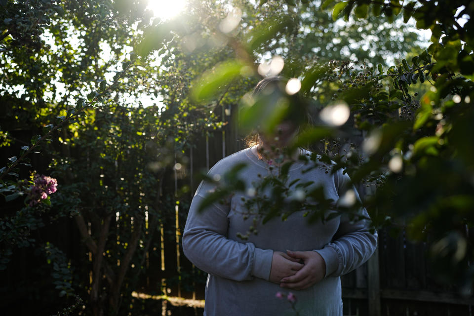 Ramona stands for a portrait Tuesday, Oct. 10, 2023, in Cordova, Tenn. “The world is scary enough without conspiracy theories,” she says. “But when you believe them, at least they can give you answers. If you’re scared of the unknown,” conspiracy theories offer “an answer, no matter how farfetched it is.” (AP Photo/George Walker IV)