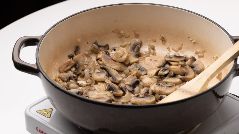 mushrooms cooking in pan