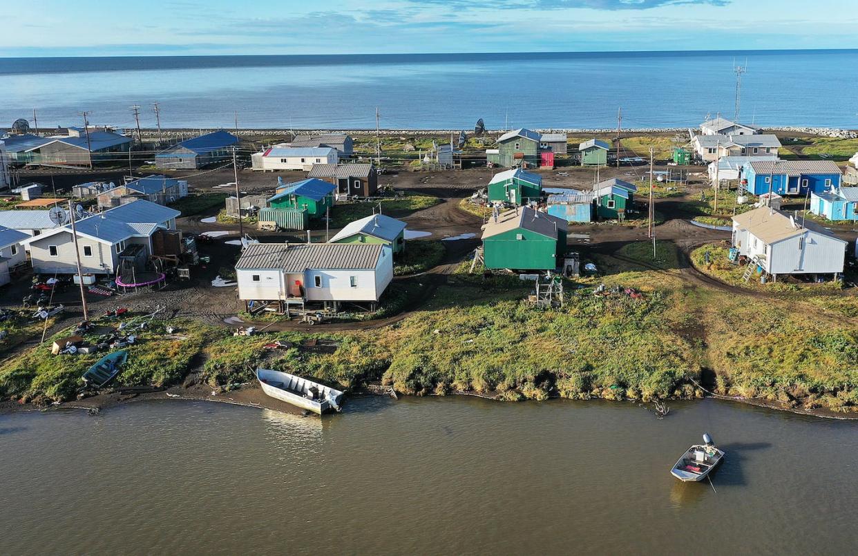Kivalina sits on a narrow barrier island on the Chukchi Sea. <a href="https://www.gettyimages.com/detail/news-photo/an-aerial-view-from-a-drone-shows-the-village-of-kivalina-news-photo/1175058955?adppopup=true" rel="nofollow noopener" target="_blank" data-ylk="slk:Joe Raedle/Getty Images;elm:context_link;itc:0;sec:content-canvas" class="link ">Joe Raedle/Getty Images</a>