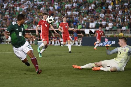 May 28, 2018; Los Angeles , Los Angeles, CA, USA; Mexico midfielder Giovani Dos Santos (10) attempts a shot against Wales during the second half at the Rose Bowl. Kelvin Kuo-USA TODAY Sports