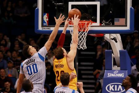 Dec 11, 2015; Orlando, FL, USA; Cleveland Cavaliers center Timofey Mozgov (20) shoots the ball over Orlando Magic forward Aaron Gordon (00) during the second half at Amway Center. The Cavaliers won 111-76. Mandatory Credit: Kim Klement-USA TODAY Sports