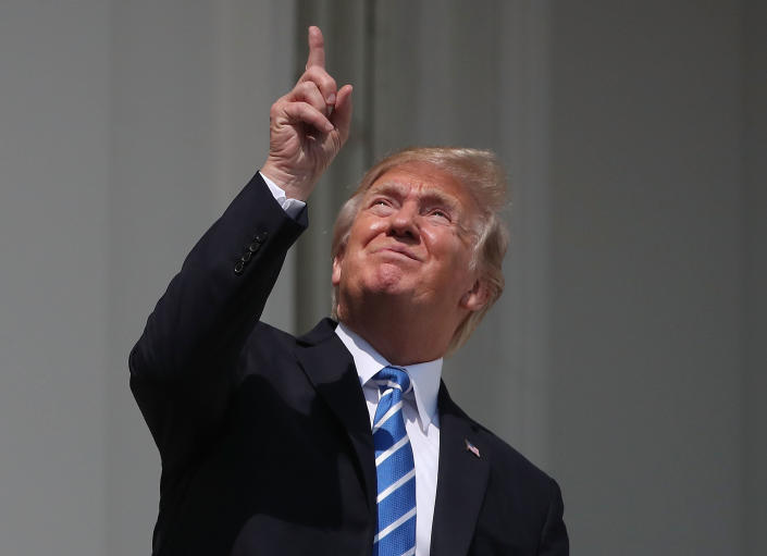 Trump looks up toward the solar eclipse&amp;nbsp;while standing on&amp;nbsp;the Truman Balcony at the White House on&amp;nbsp;Aug. 21.