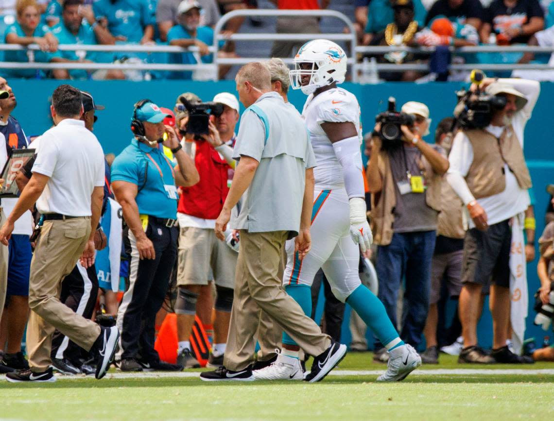 Miami Dolphins guard Austin Jackson (73) walks out the field after he got injured in a play during second quarter of an NFL football game against the New England Patriots at Hard Rock Stadium on Sunday, September 11, 2022 in Miami Gardens, Florida.