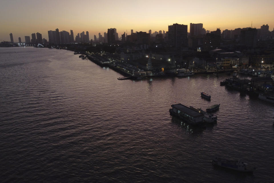 The sun rises in Belem, Brazil, Monday, Aug. 7, 2023. Belem will host the Amazon Summit, a meeting by the nations that are part of the Amazon Cooperation Treaty: Brazil, Bolivia, Colombia, Guyana, Ecuador, Peru, Suriname, Venezuela and French Guiana. (AP Photo/Eraldo Peres)