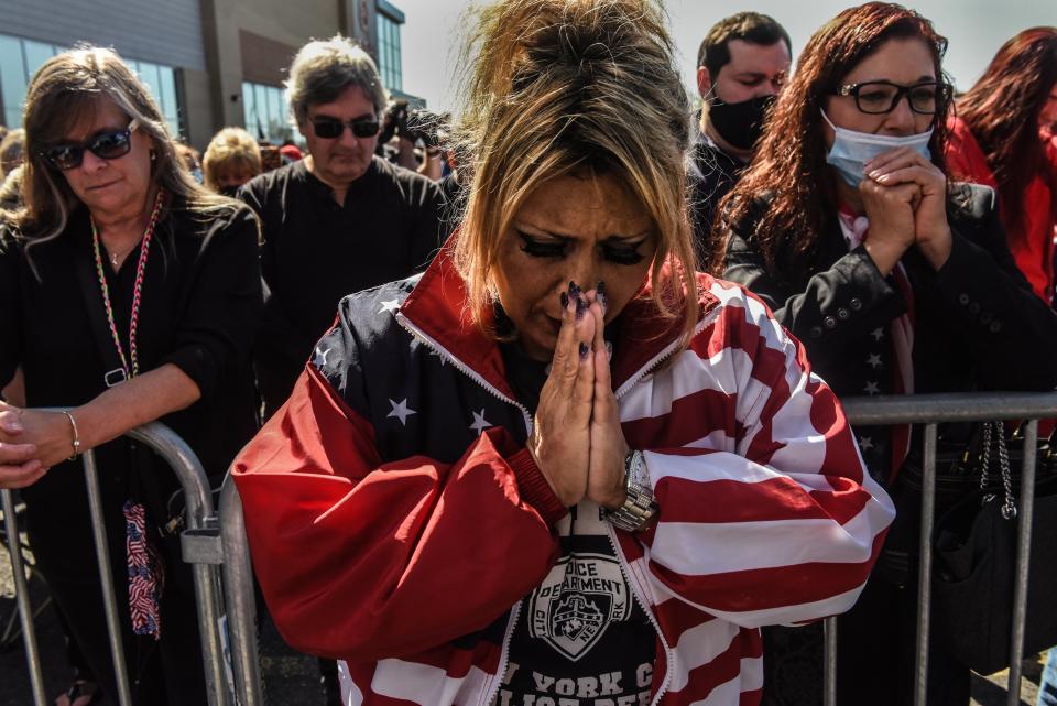 A supporter prays during a pro-Trump rally on October 3, 2020 on Staten Island in New York CityGetty Images