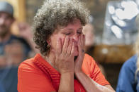 Lisa Crouser reacts Wednesday, Aug. 4, 2021, in Redmond, Ore., as her son Ryan Crouser wins the gold medal in the shot put at the Tokyo Olympics. (AP Photo/Nathan Howard)