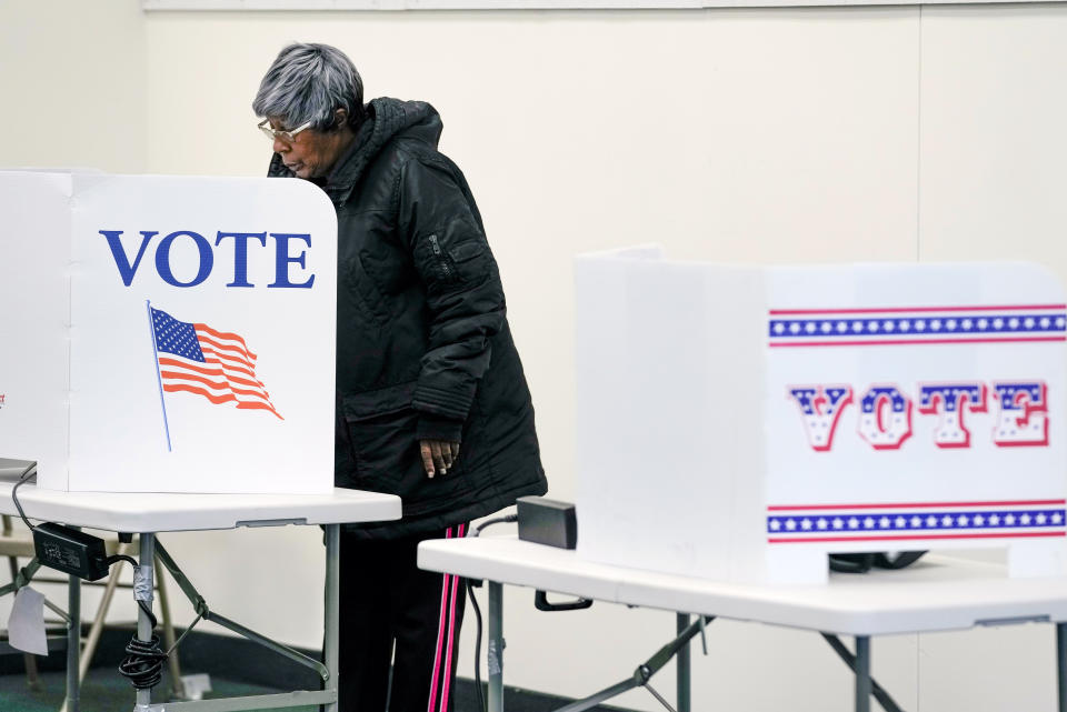 A voter casts an early ballot at a polling station Thursday, Feb. 9, 2023, in Milwaukee. Recent revelations about Republican election strategies targeting minority communities in Wisconsin’s biggest city came as no surprise to many Black voters. For years, voting rights advocates have accused Wisconsin Republicans of pushing policies to suppress voters of color and lower-income voters. Many of those policies centered on the Democratic stronghold of Milwaukee. (AP Photo/Morry Gash)