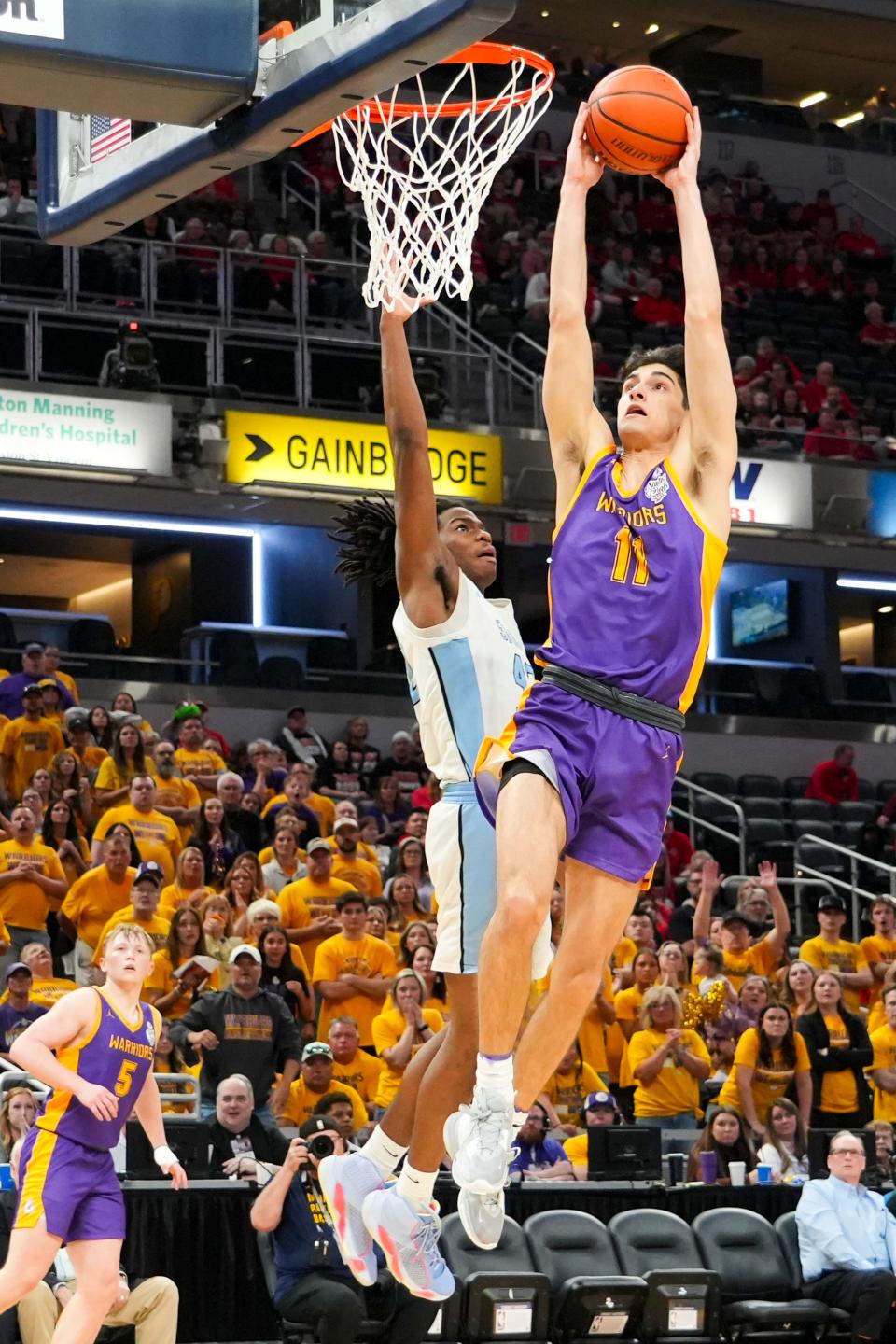 Scottsburg Warriors Jack Miller (11) dunks the ball against the South Bend St. Joseph Huskies on Saturday, March 30, 2024, during the IHSAA boys basketball Class 3A state championship game at Gainbridge Fieldhouse in Indianapolis. The Scottsburg Warriors defeated the South Bend St. Joseph Huskies 67-57.