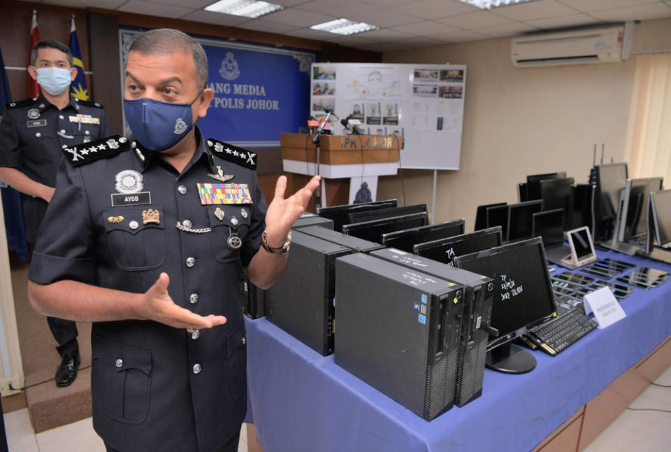 Johor police chief Datuk Ayob Khan Mydin Pitchay with the seized items during a media conference held at the Johor police contingent headquarters, September 27, 2021. — Bernama pic