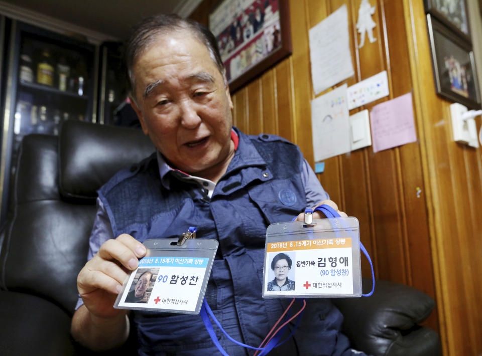 In this Aug. 23, 2018, photo, ID cards of Ham Sung-chan, left, and his wife Kim Hyung-ae for the Separated Family Reunion Meeting are shown by Ham during an interview at his house in Dongducheon, South Korea. After nearly 70 years of a separation forced by a devastating 1950-53 war that killed and injured millions and cemented the division of the Korean Peninsula into North and South, Ham, 93, and his North Korean brother only got a total of 12 hours together. (AP Photo/Ahn Young-joon)