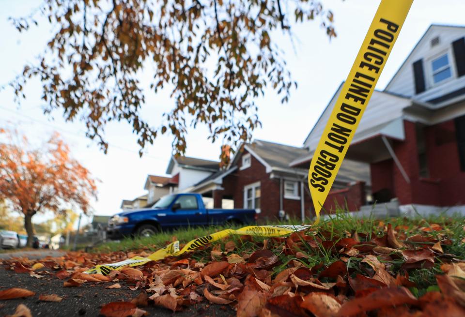 Police tape dangles near a shooting scene in the 200 block of Cecil Avenue where a man died Monday night. A woman who was also shot is in critical condition.  Nov.9, 2021
