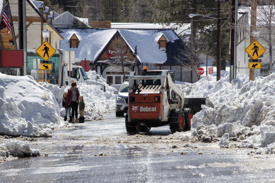 Big Bear Lake streets are still choked with snow following successive storms which blanketed San Bernardino Mountain communities on Friday, March 3, 2023 in Big Bear Lake, Calif.<span class="copyright">Brian van der Brug–Los Angeles Times via Getty Images</span>