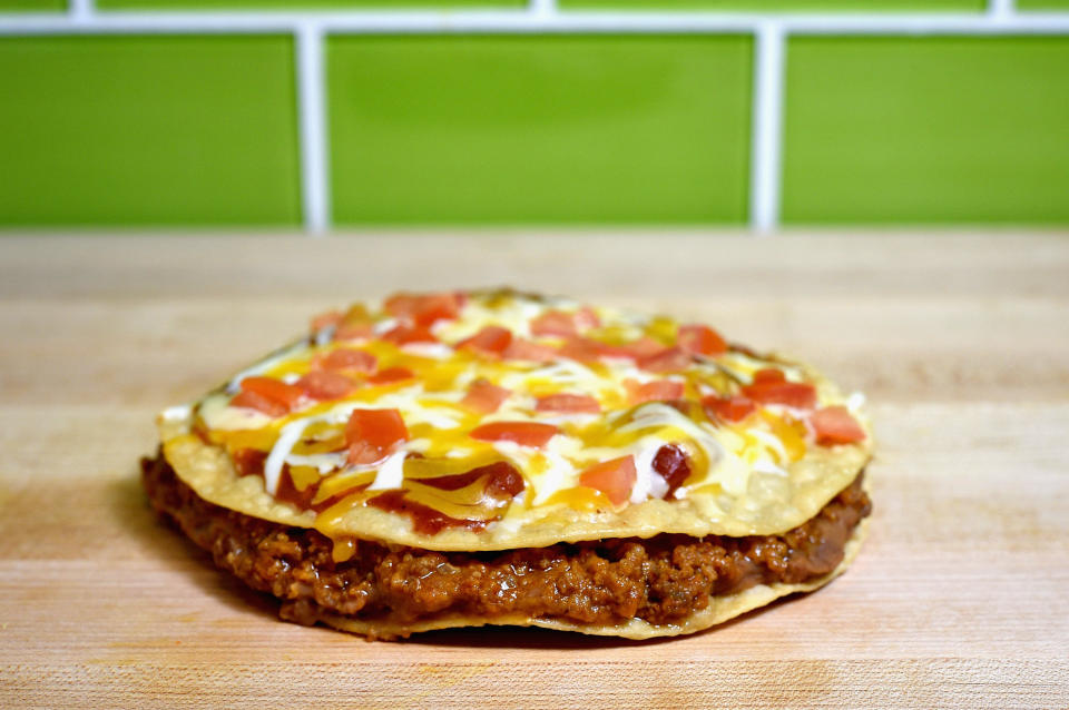 IRVINE, CA - SEPTEMBER 12:  Taco Bell's Mexican Pizza remains a popular item and menu staple.  (Photo by Joshua Blanchard/Getty Images for Taco Bell)