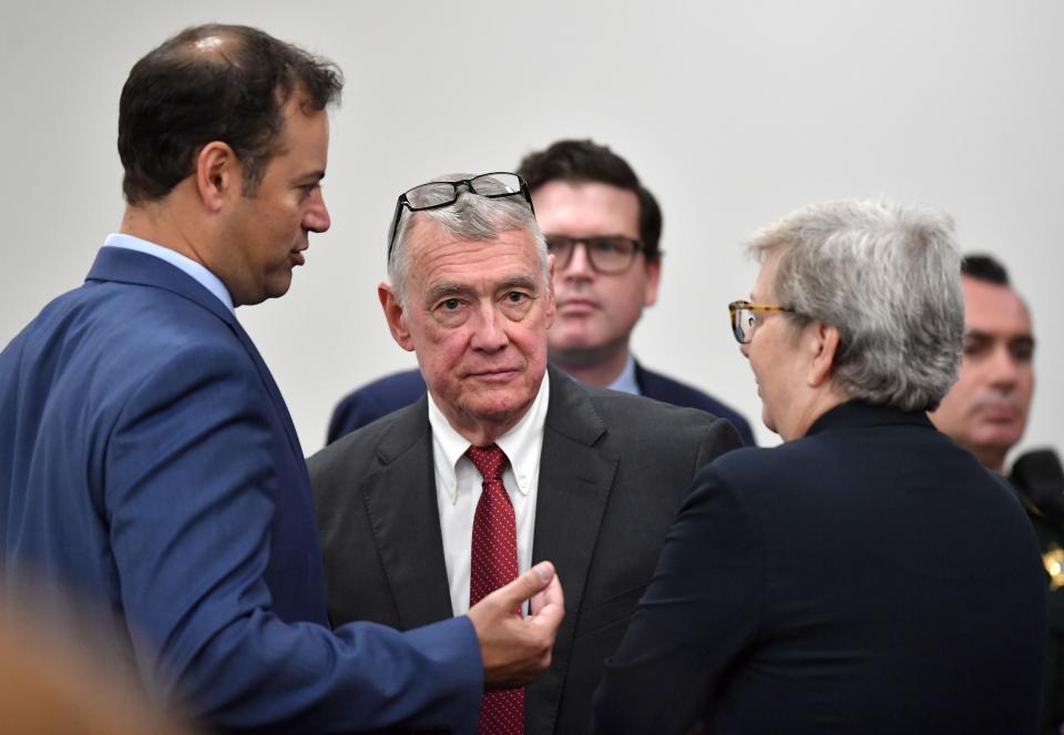 Members of the Johns Hopkins All Children's Hospital legal team, from left, Ethen Shapiro, C. Howard Hunter, David Hughes and Patricia Crauwels, confer following a sidebar with Judge Hunter Carroll at the South County Courthouse in Venice, FL on Thursday, Oct. 26, 2023. The Kowalski family is suing Johns Hopkins All Children's Hospital for false imprisonment, negligent infliction of emotional distress, medical negligence, battery, and other claims more than a year after the family matriarch, Beata Kowalski, took her life following allegations she was abusing her daughter, Maya Kowalski. Pool photo/Mike Lang/Sarasota Herald-Tribune