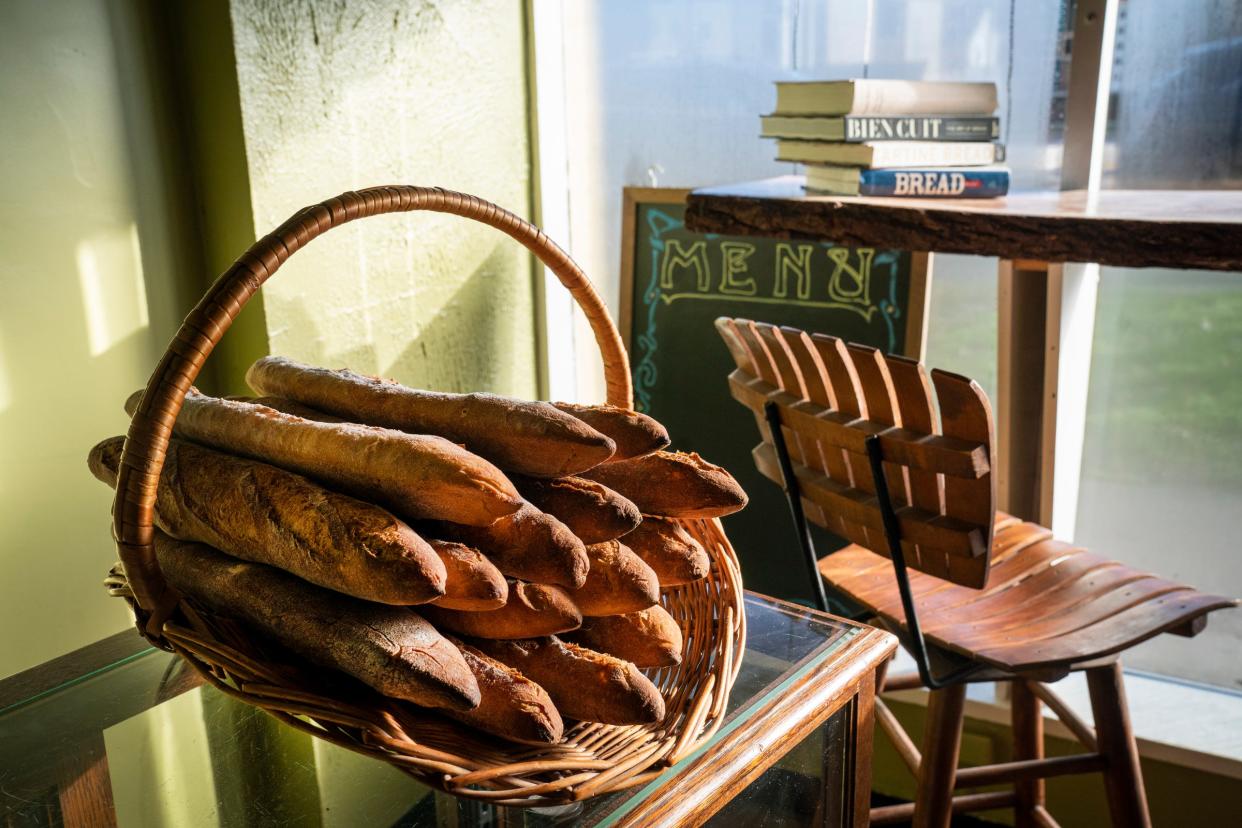 A basket of baguettes is ready for sale as Maxwell Leonard prepares a variety of breads for the day at his shop There is No Secret Bakery on Livernois Street in Ferndale on Wednesday, Feb. 7, 2024. The bakery is owned by Maxwell Leonard and is open Wednesdays from 10am-3pm and Saturdays from 9am to 2pm.