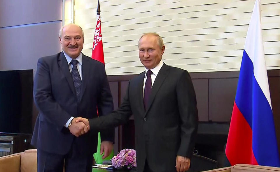 Russian President Vladimir Putin shakes hands with his Belarusian counterpart Alexander Lukashenko during a meeting in Sochi, Russia, September 14, 2020, in a still image taken from video provided by the Russian president's office. / Credit: Russian Presidential Executive Office/Reuters