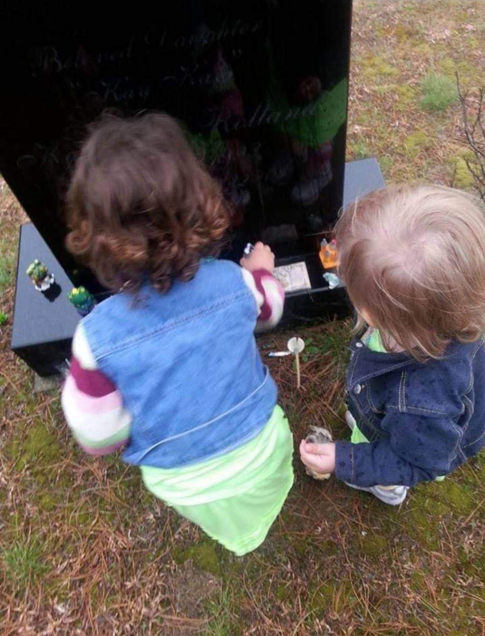 Two of Elizabeth Krasinski's children, visiting their aunt's grave on her birthday. (Courtesy Elizabeth Krasinski)