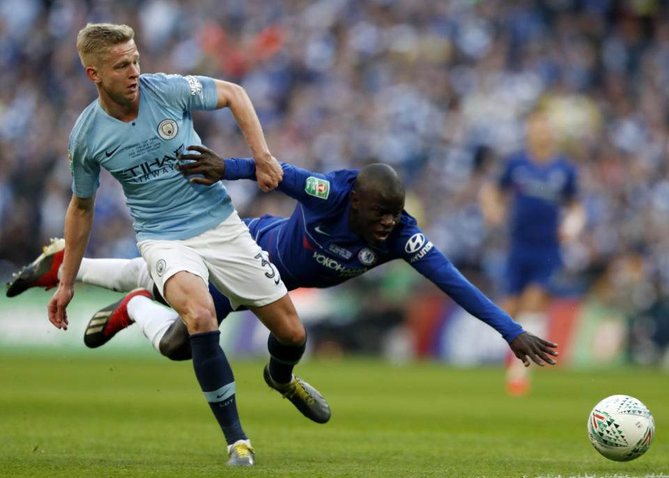 CORRECTING IDENTITY OF CHELSEA PLAYER TO NGOLO KANTE - Manchester City's Oleksandr Zinchenko, left, challenges Chelsea's Ngolo Kante, right, during the English League Cup final soccer match between Chelsea and Manchester City at Wembley stadium in London, England, Sunday, Feb. 24, 2019. (AP Photo/Alastair Grant)