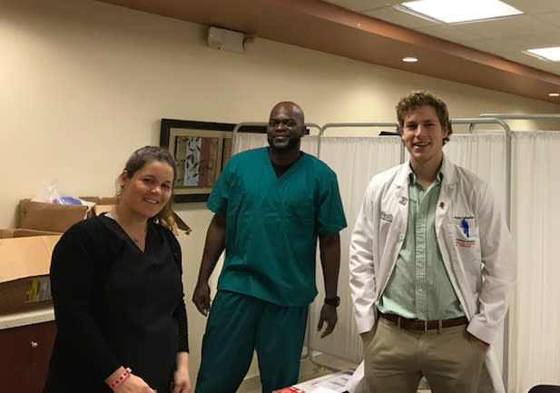 Dr. Katrina Celis, Director of Research Support Larry Adams, and Dr. Parker Bussies prepare to see Alzheimer’s disease patients and their families in Puerto Rico for PRADI. (Courtesy John P. Hussman Institute for Human Genomics)