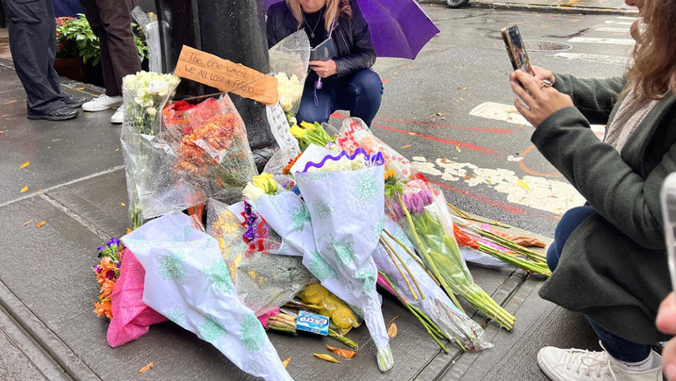 Fans build a shrine for Matthew Perry outside the apartment from “Friends.”