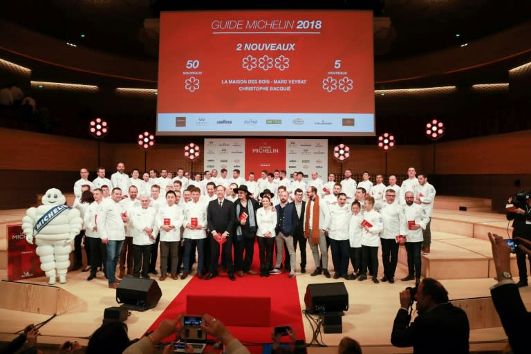 Laureates pose at the end of the Michelin guide award ceremony at La Salle Musicale in Boulogne-Billancourt near Paris on February 5, 2018