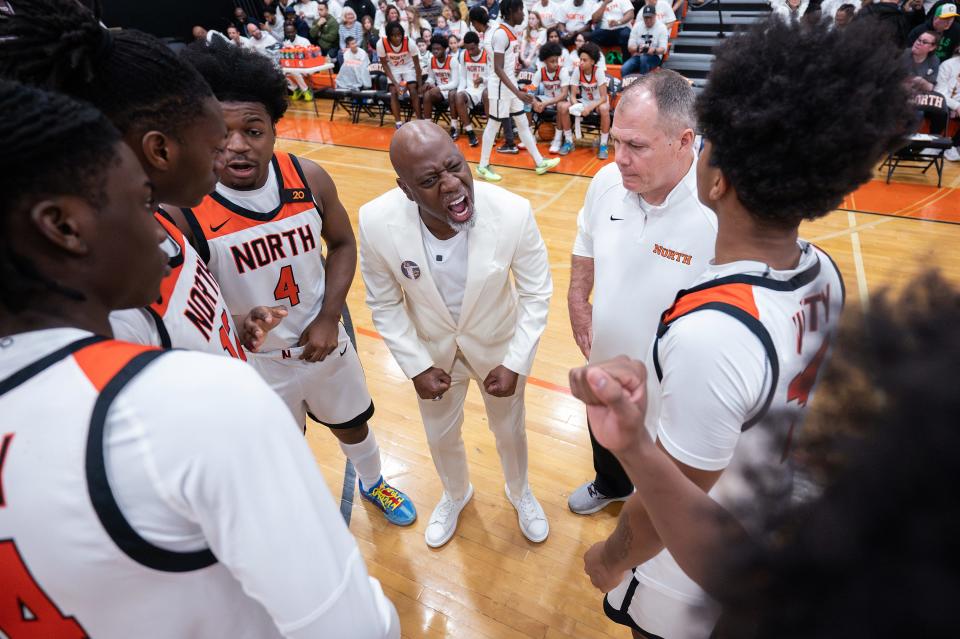 North coach Al Pettway gets the starting five hyped up before last Friday night's Division 1 quarterfinal against Lowell.