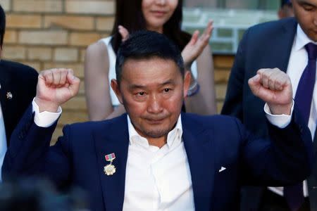 Presidential candidate Khaltmaa Battulga gestures outside a polling station after casting his ballot in Ulaanbaatar, Mongolia, June 26, 2017. REUTERS/B. Rentsendorj