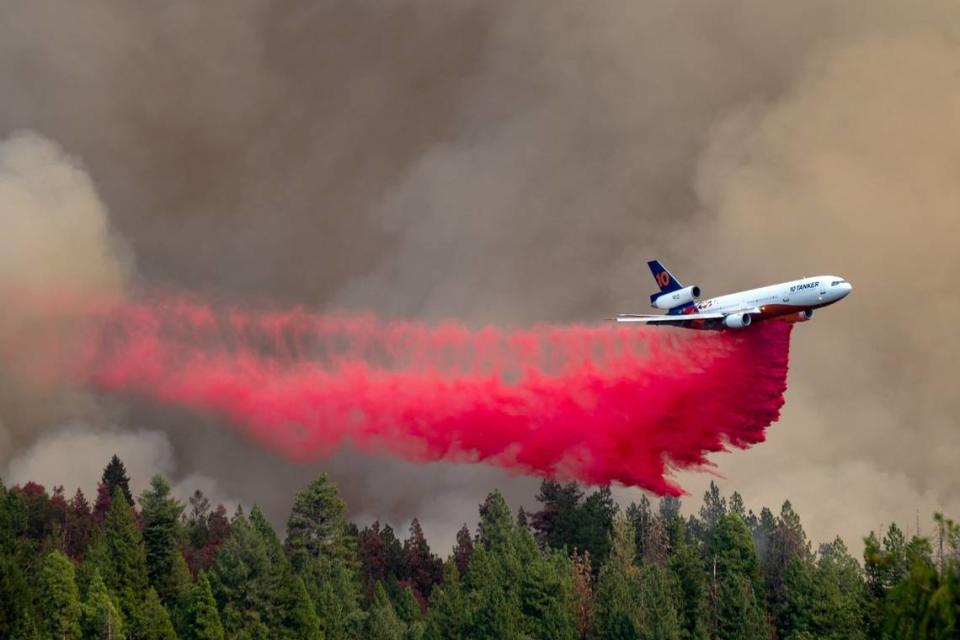 An air tanker drops fire retardant on the Mosquito Fire as smoke fills the sky above Foresthill in 2022.