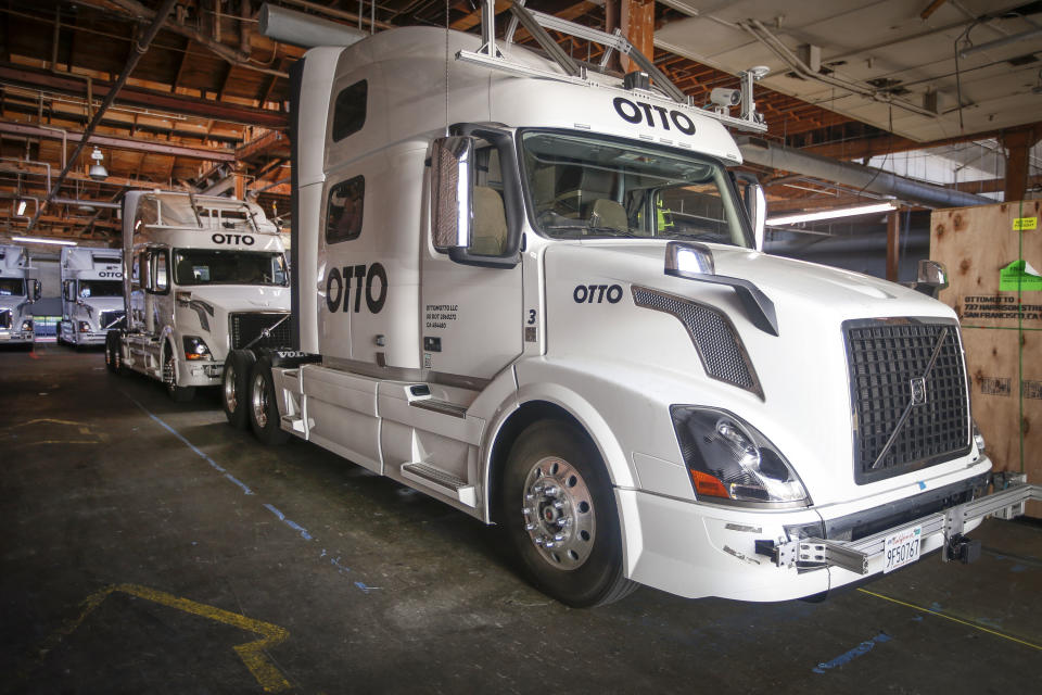 FILE - Otto's self-driving, big-rig trucks are lined up during a demonstration at the Otto headquarters on Aug. 18, 2016, in San Francisco. Gov. Gavin Newsom has vetoed a bill that would have required human drivers to be onboard self-driving trucks, a measure that union leaders and truck drivers said would save jobs. The legislation vetoed Friday, Sept. 22, 2023, night would have banned self-driving trucks weighing more than 10,000 pounds (4,536 kilograms), vehicles from UPS delivery vans to massive big rigs, from operating on public roads unless a human driver is on board. (AP Photo/Tony Avelar, File)