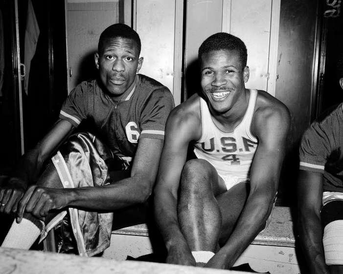 K.C. Jones, captain of the University of San Francisco Dons, right, is shown with teammate Bill Russell, March 1, 1956. (AP Photo/Robert Houston)