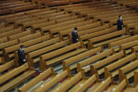 Pastors wearing face masks to help protect against the spread of the coronavirus pray during a service at the Yoido Full Gospel Church in Seoul, South Korea, Sunday, Sept. 20, 2020. South Korea's new coronavirus tally has fallen below 100 for the first time in more than a month. (AP Photo/Ahn Young-joon)