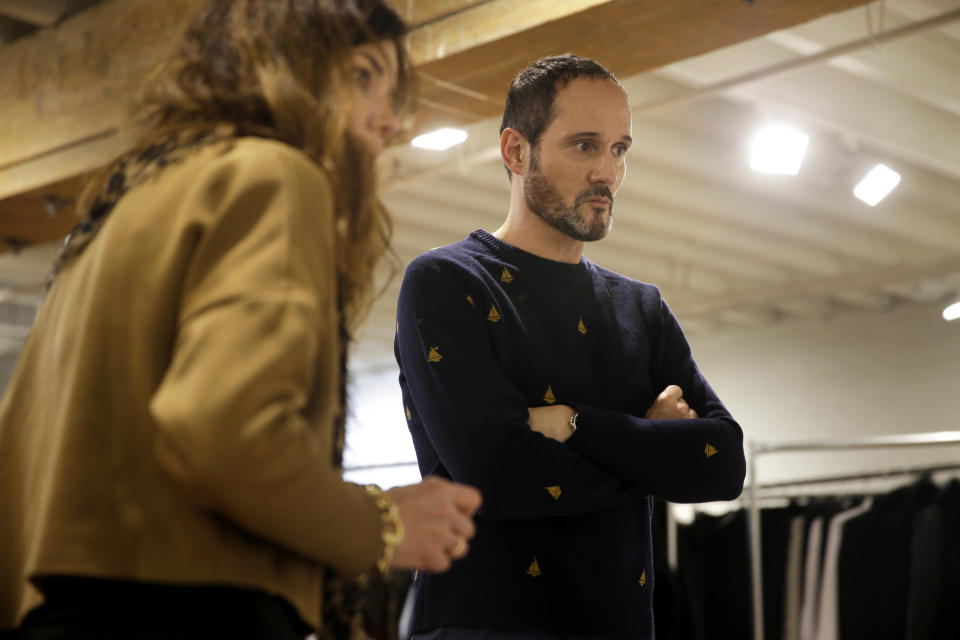 In this Monday, Feb. 3, 2014 photo, Josep Font, creative director of DelPozo, right, talks with his casting director Esther Garcia during a model casting in New York. (AP Photo/Seth Wenig)