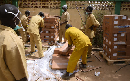 Workers arrange voting materials for distribution at the Independent National Electoral Commission (INEC) headquarters in Kano ahead of the country's presidential election, Nigeria February 15, 2019. REUTERS/Sani Maikatanga