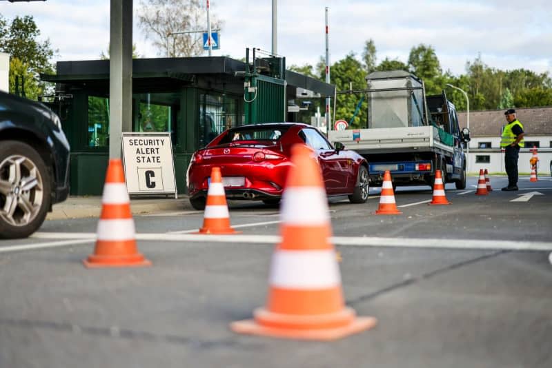 Soldiers check the entrance to the NATO air base, with the Security Alert State C sign on the left. NATO had declared the second-highest warning level at its air base in Geilenkirchen, North Rhine-Westphalia. Christoph Reichwein/dpa