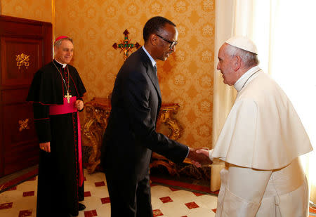 Rwanda's President Paul Kagame is welcomed by Pope Francis during a private meeting at the Vatican March 20, 2017. REUTERS/Tony Gentile