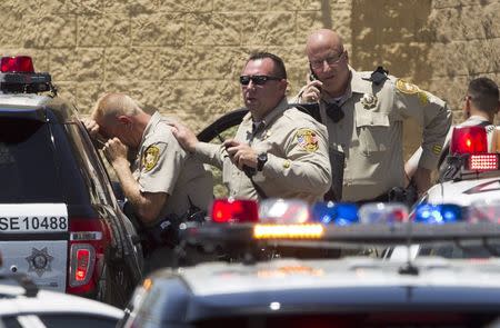 Metro Police officers are shown outside a Wal-Mart after a shooting in Las Vegas June 8, 2014. REUTERS/Las Vegas Sun/Steve Marcus