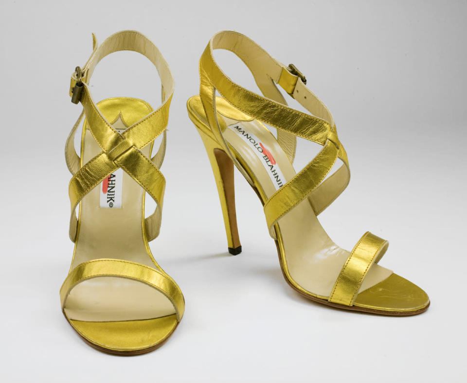 A pair of strapphy gold Manolo Blahnik heels