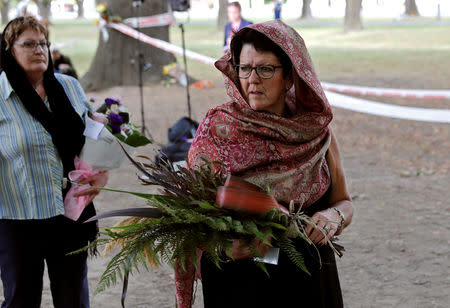 Women wearing scarfs are seen at Hagley Park outside Al Noor mosque in Christchurch, New Zealand, March 22, 2019. REUTERS/Jorge Silva