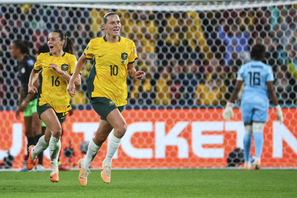 Australia's Emily Van Egmond, right, celebrates with teammates after scoring the opening goal during the Women's World Cup Group B soccer match between Australia and Nigeria In Brisbane, Australia, Thursday, July 27, 2023. (AP Photo/Tertius Pickard)