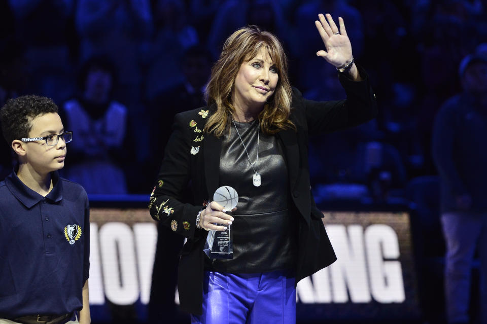 Nancy Lieberman, right, accepts the 18th annual National Civil Rights Museum Sports Legacy Award along with fellow honorees Gary Payton, Luol Deng, and Eddie George before the 21st annual Martin Luther King Jr. Day Celebration Game between the Phoenix Suns and the Memphis Grizzlies, Monday, Jan. 16, 2023, in Memphis, Tenn. (AP Photo/Brandon Dill)