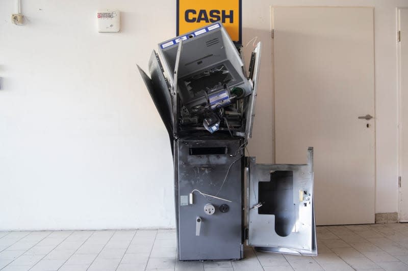 A destroyed ATM stands in a shopping center in Neu-Hohenschoenhausen after perpetrators have blown it up. Dutch gangs targeting cash machines with explosives have shifted their focus to Germany, police reported in The Hague on Saturday. Paul Zinken/dpa