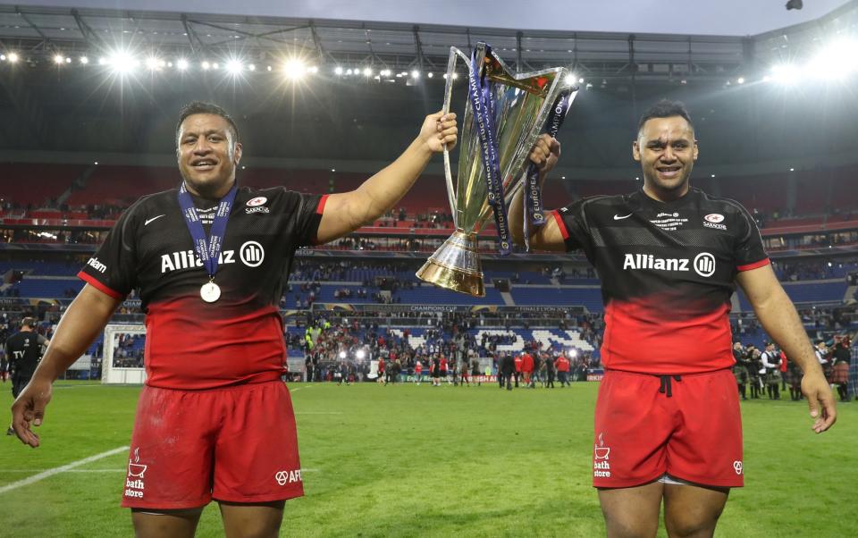 Billy and Mako Vunipola lift the Champions Cup trophy