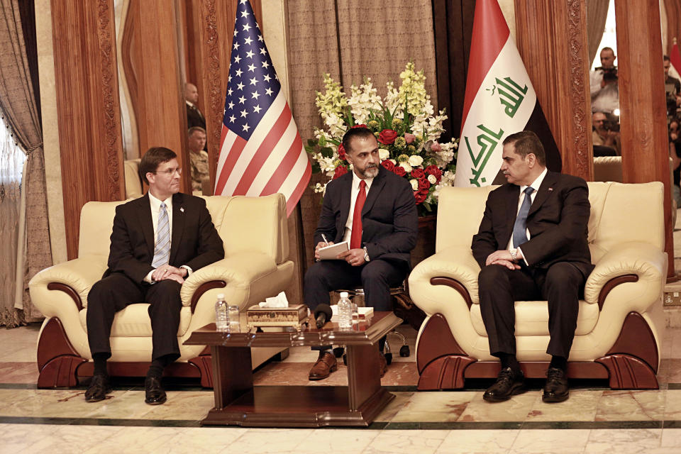 Iraqi Defense Minister Najah al-Shammari, right, meets with visiting U.S. Defense Secretary Mark Esper, left, at the Ministry of Defense in Baghdad, Iraq, Wednesday, Oct. 23, 2019. Esper has arrived in Baghdad on a visit aimed at working out details about the future of American troops that are withdrawing from Syria to neighboring Iraq. (AP Photo/Hadi Mizban)