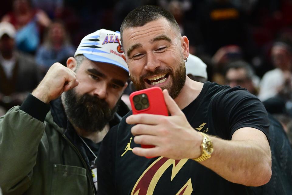 Mar 5, 2024; Cleveland, Ohio, USA; Cleveland natives and NFL players Travis, right, and Jason Kelce celebrate after the Cleveland Cavaliers beat the Boston Celtics during the second half at Rocket Mortgage FieldHouse. Mandatory Credit: Ken Blaze-USA TODAY Sports