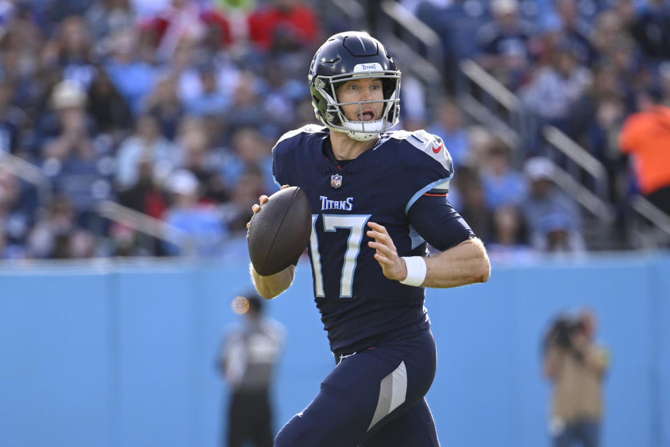 Tennessee Titans quarterback Ryan Tannehill (17) rolls out to pass during the first half of an NFL football game against the Seattle Seahawks on Sunday, Dec. 24, 2023, in Nashville, Tenn. (AP Photo/John Amis)