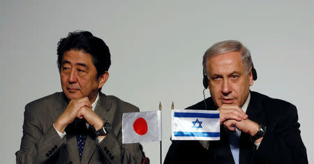 Japan's Prime Minister Shinzo Abe (L) and his Israeli counterpart Benjamin Netanyahu sit together during their joint statements in Jerusalem January 18, 2015. REUTERS/Baz Ratner/File Photo