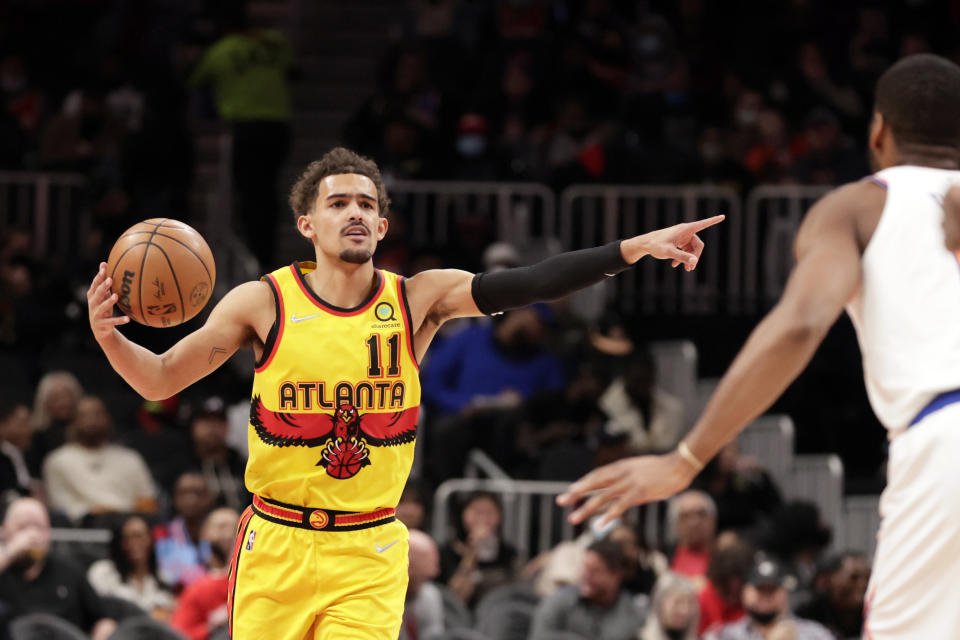 Atlanta Hawks guard Trae Young (11) signals to teammates during the first half of an NBA basketball game against New York Knicks Saturday, Jan. 15, 2022, in Atlanta. (AP Photo/Butch Dill)