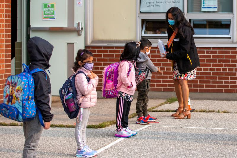 FILE PHOTO: Students arrive for the first time since the start of the COVID-19 pandemic in Scarborough