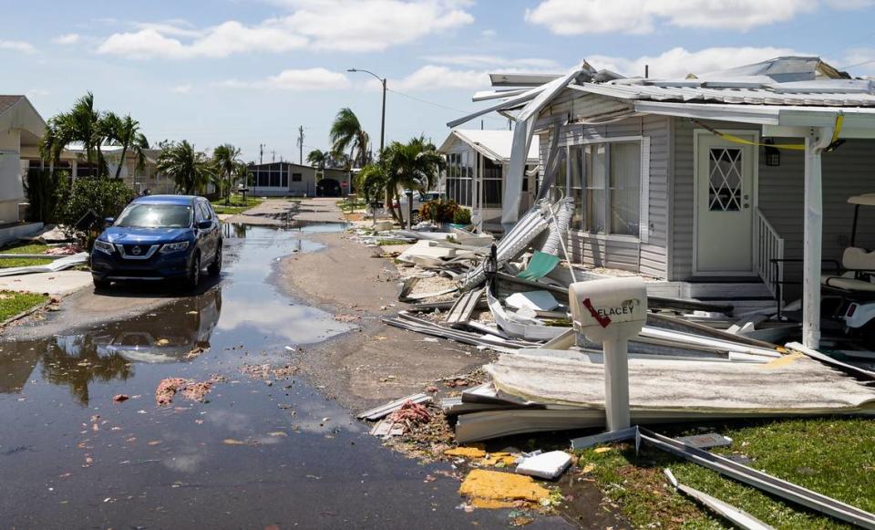 Hurricane debris is scattered throughout the Tamiami Village mobile home community in North Fort Myers..